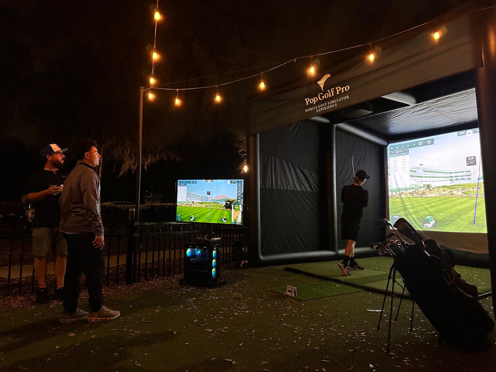 Guests enjoying golf simulator